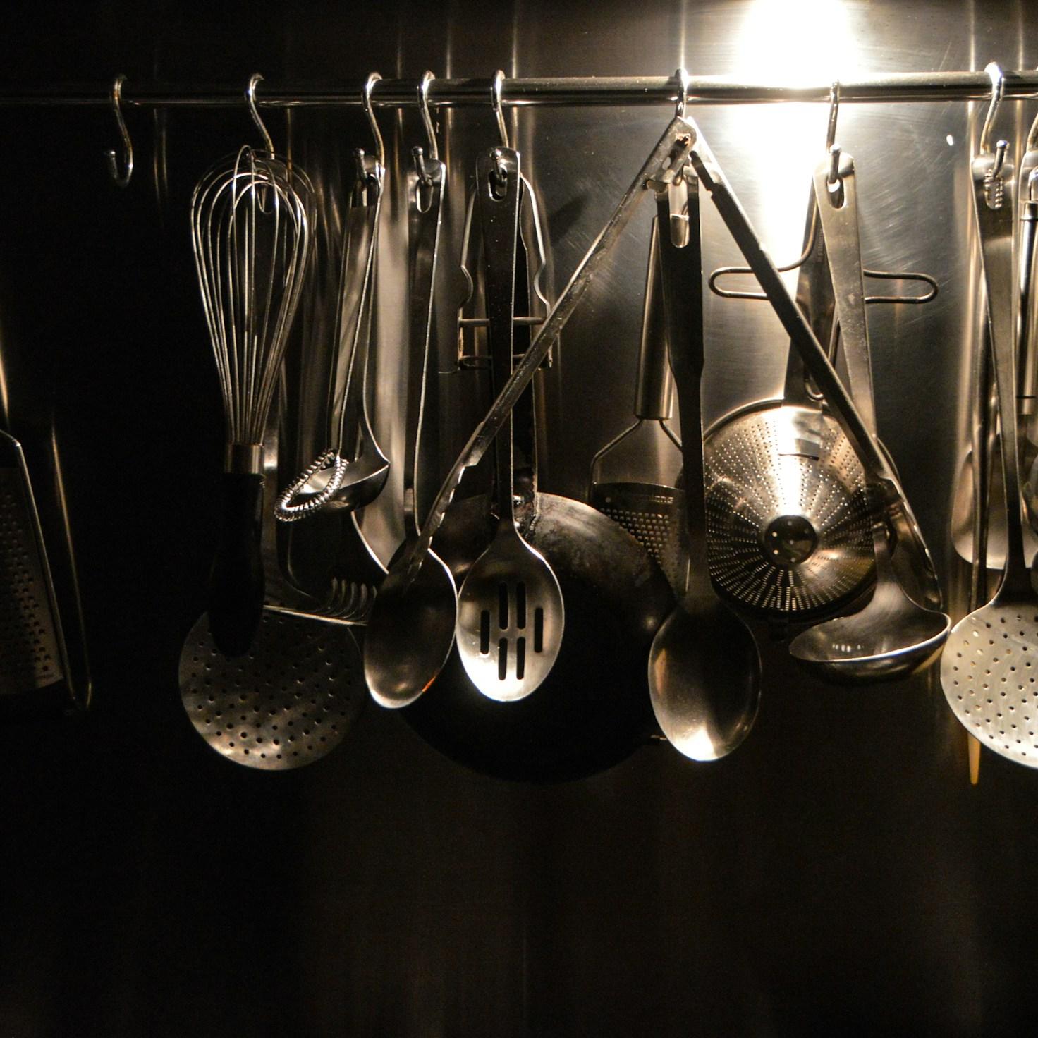 Diverse group of community members sharing a meal together, illustrating the social bonds formed through collaborative cooking