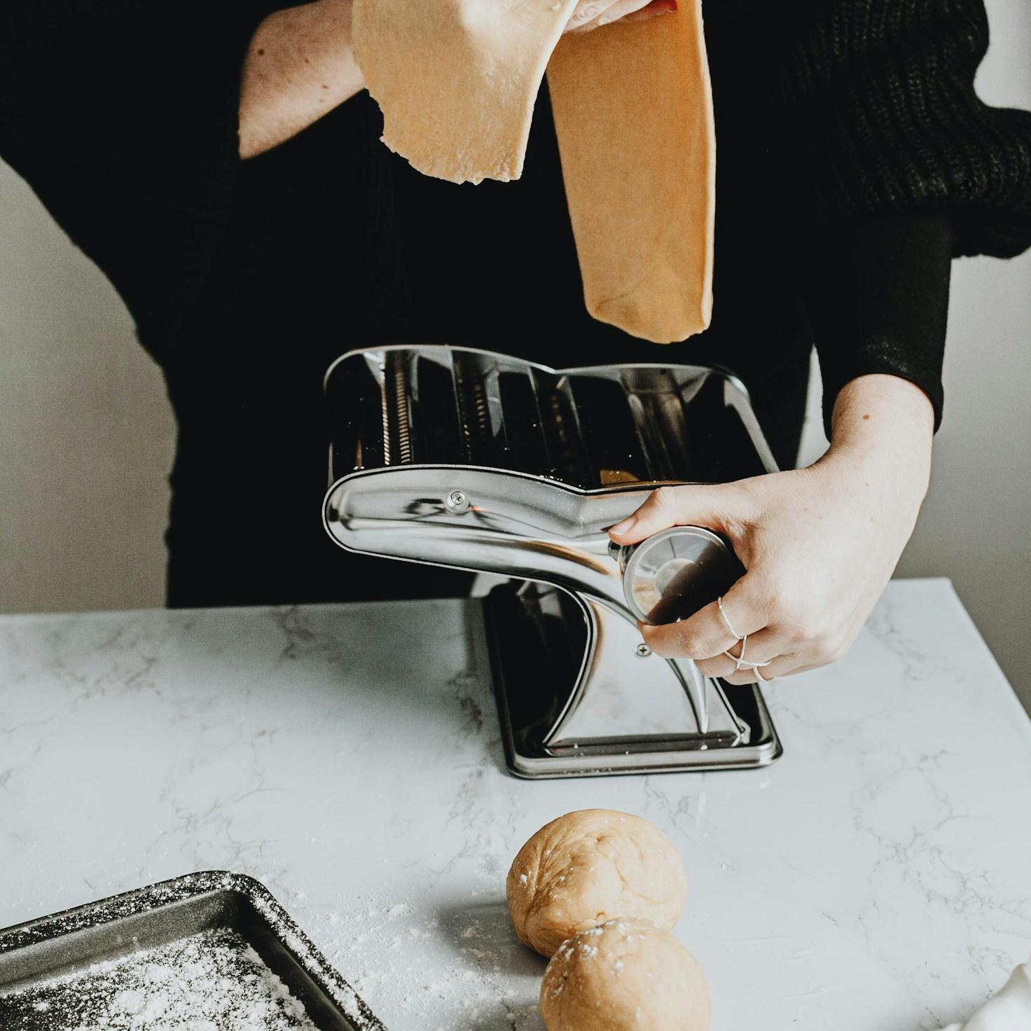 Community members collaborating in a contemporary kitchen space, swapping recipes and techniques